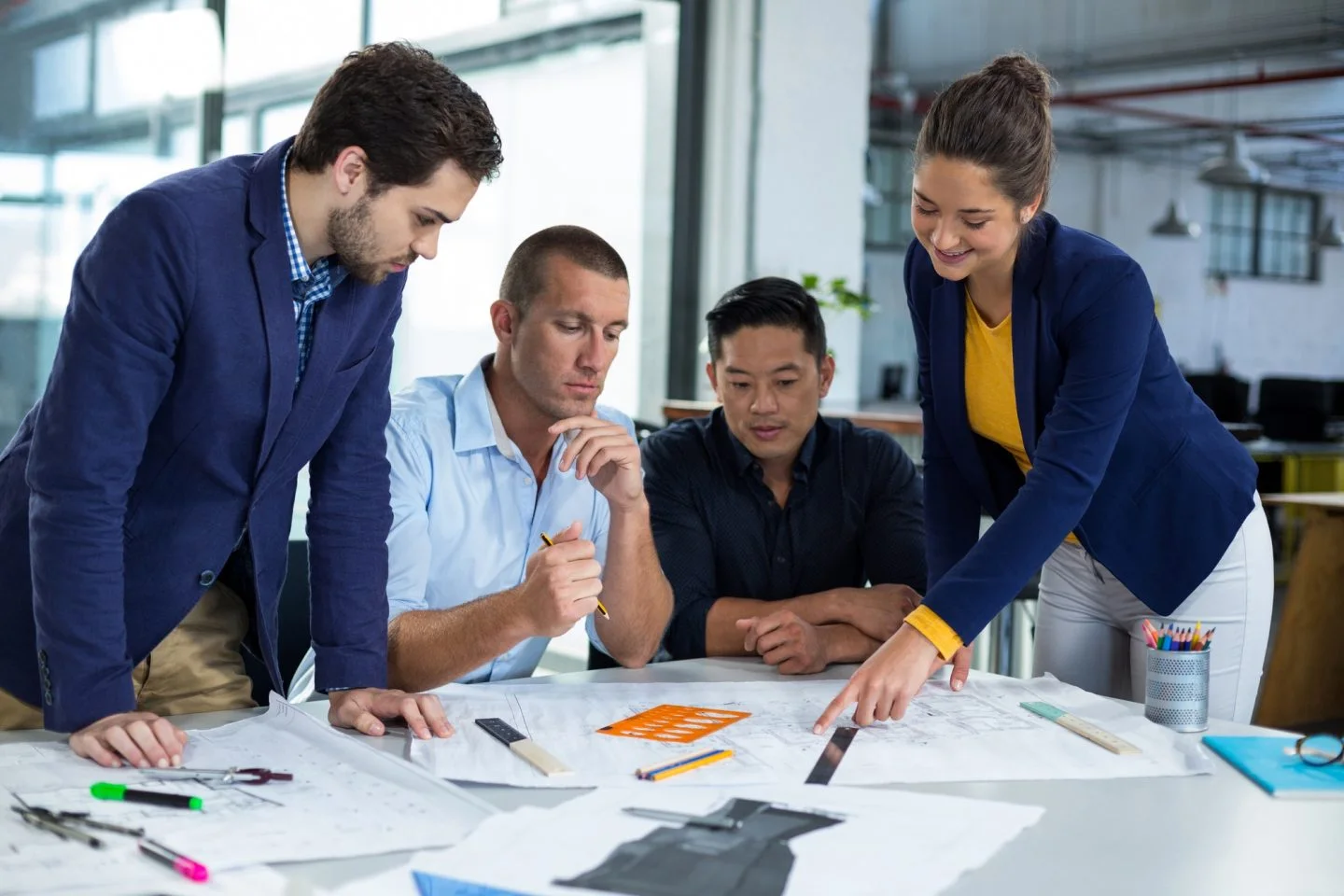 businesspeople having discussion over document